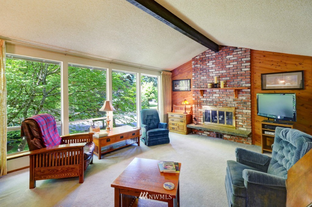 16631 24th Drive Southeast Bothell, WA 98012 - Photo 4 of 24 a living room with furniture and a floor to ceiling window