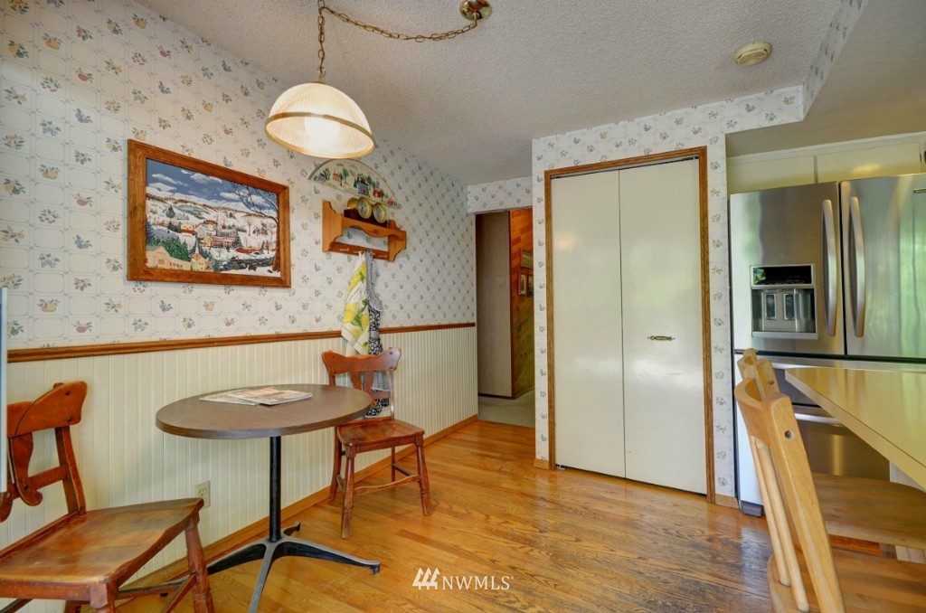 16631 24th Drive Southeast Bothell, WA 98012 - Photo 5 of 24 a view of a dining room with furniture and a chandelier