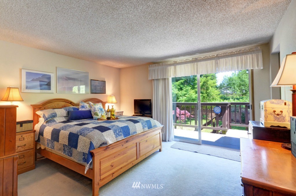 16631 24th Drive Southeast Bothell, WA 98012 - Photo 10 of 24 a bedroom with a bed and a large window
