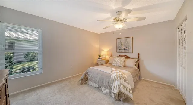 a view of a house with swimming pool and yard