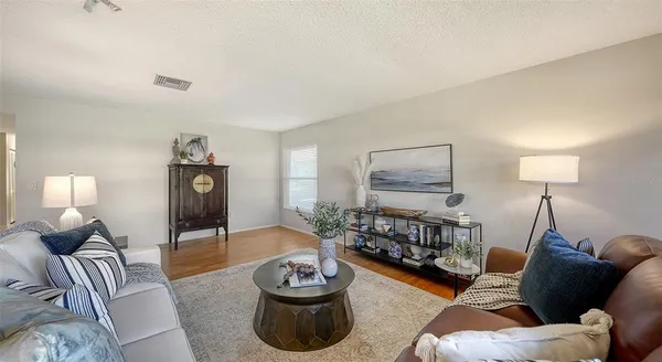 a view of a dining room with furniture window and wooden floor