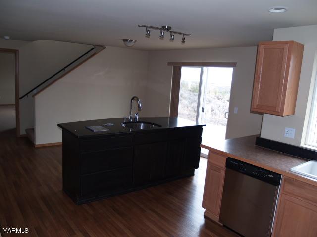 350 Keystone Road Yakima, WA 98908 - Photo 4 of 28 a kitchen with a sink and wooden floor