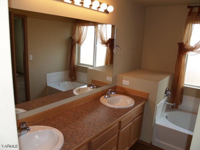 350 Keystone Road Yakima, WA 98908 - Photo 8 of 28 a bathroom with a sink double vanity and a mirror