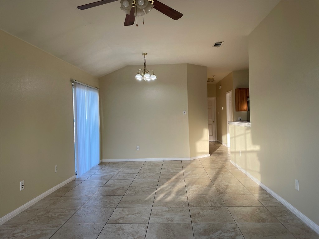 Undisclosed Address Austin, TX 78729 - Photo 2 of 8 a view of an empty room with a chandelier fan