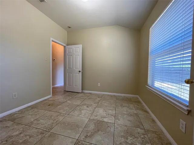a view of an empty room and window
