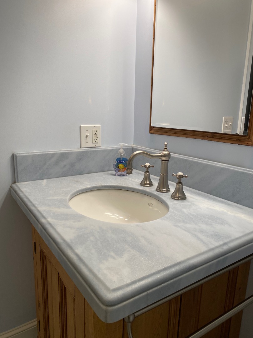 12 Spring Street Vineyard Haven, MA 02568 - Photo 12 of 40 a bathroom with a sink and a mirror