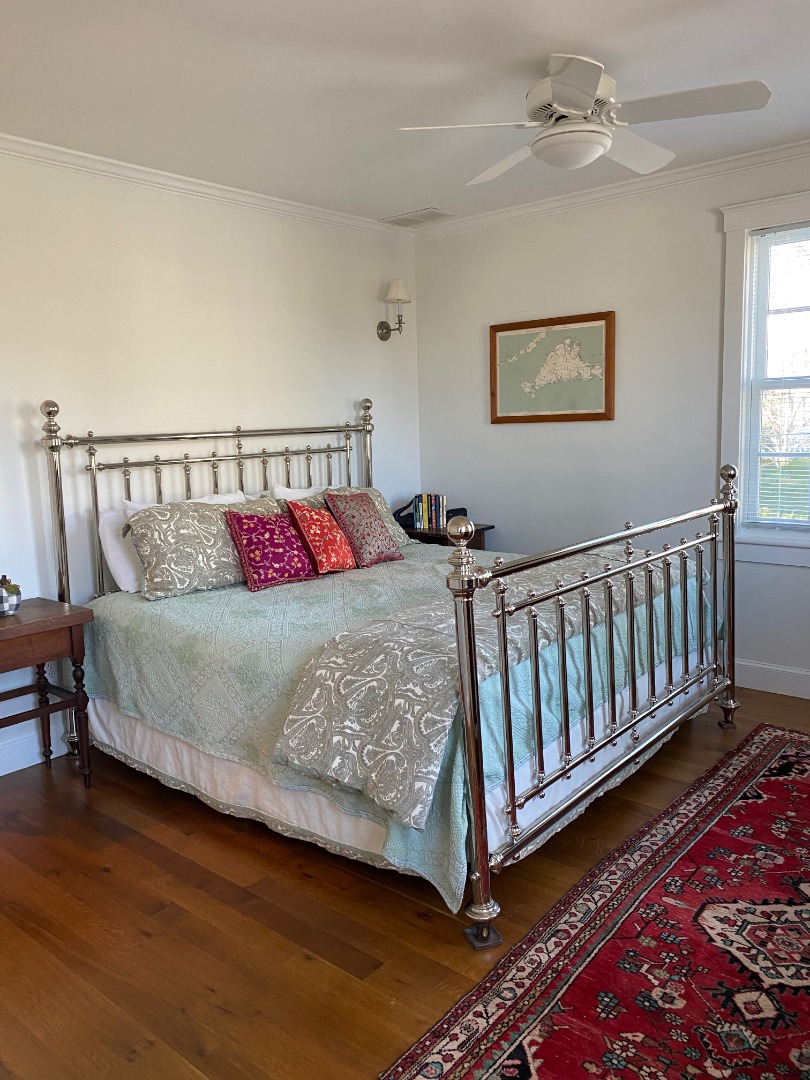 12 Spring Street Vineyard Haven, MA 02568 - Photo 16 of 40 a bed sitting in a bedroom next to a window