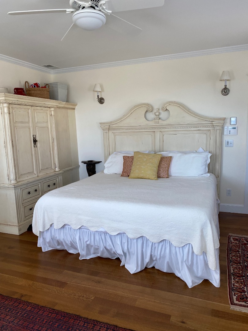 12 Spring Street Vineyard Haven, MA 02568 - Photo 19 of 40 a bedroom with a bed and wooden floor
