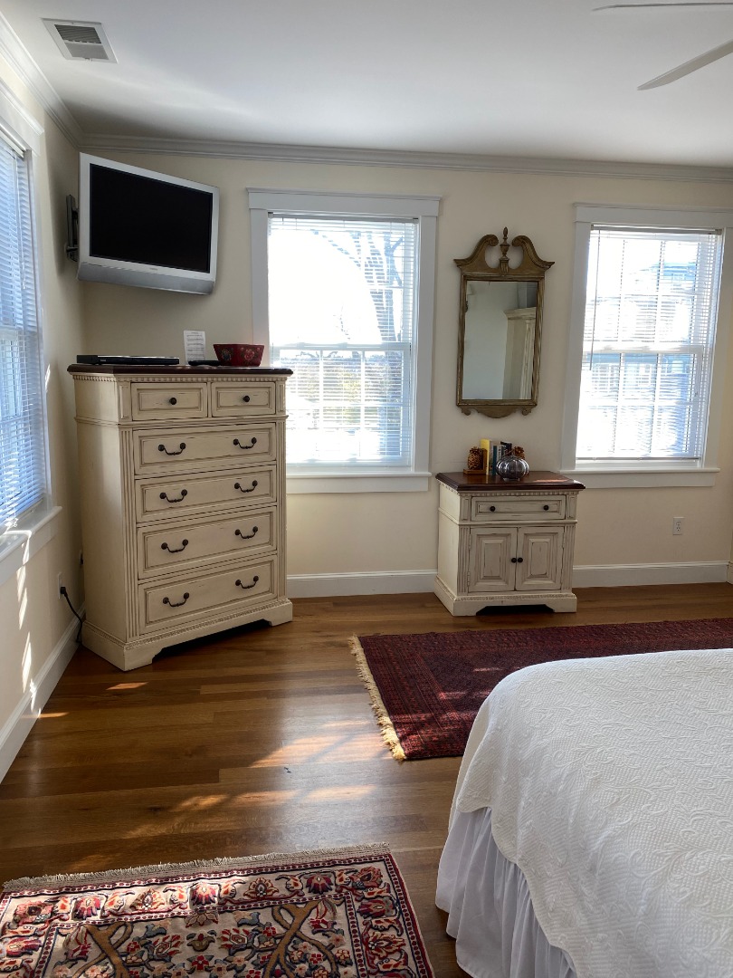 12 Spring Street Vineyard Haven, MA 02568 - Photo 20 of 40 a bedroom with a bed and flat screen tv
