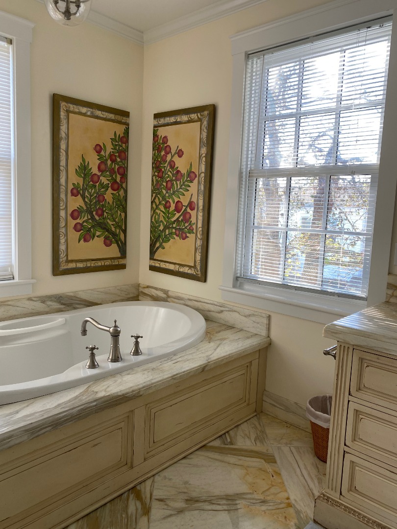 12 Spring Street Vineyard Haven, MA 02568 - Photo 23 of 40 a bathroom with a bathtub and a window