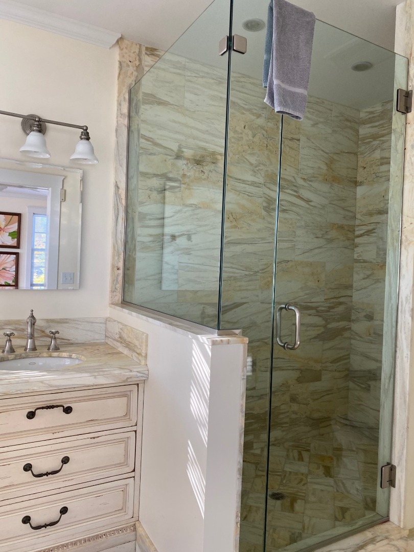 12 Spring Street Vineyard Haven, MA 02568 - Photo 24 of 40 a bathroom with a shower sink and mirror