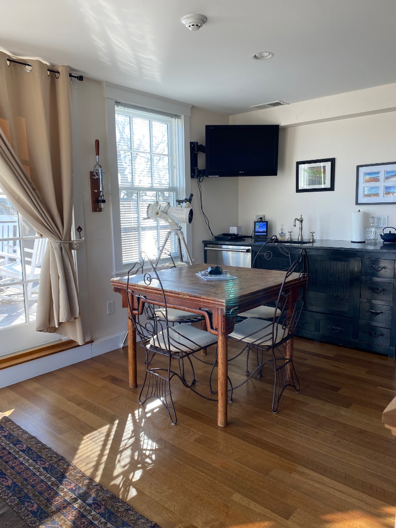12 Spring Street Vineyard Haven, MA 02568 - Photo 25 of 40 a view of a dining room with furniture window and wooden floor