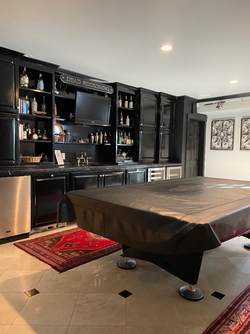 12 Spring Street Vineyard Haven, MA 02568 - Photo 34 of 40 a kitchen with stainless steel appliances kitchen island granite countertop a sink and cabinets