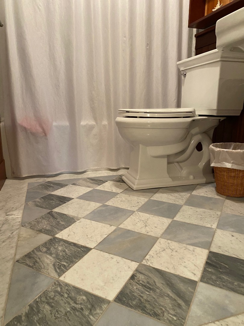 12 Spring Street Vineyard Haven, MA 02568 - Photo 36 of 40 a bathroom with a toilet and a shower curtain