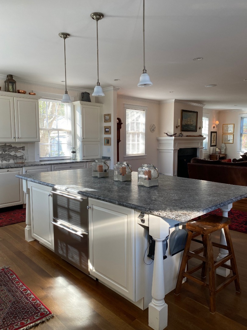 12 Spring Street Vineyard Haven, MA 02568 - Photo 5 of 40 a kitchen with stainless steel appliances granite countertop a stove a sink and a refrigerator