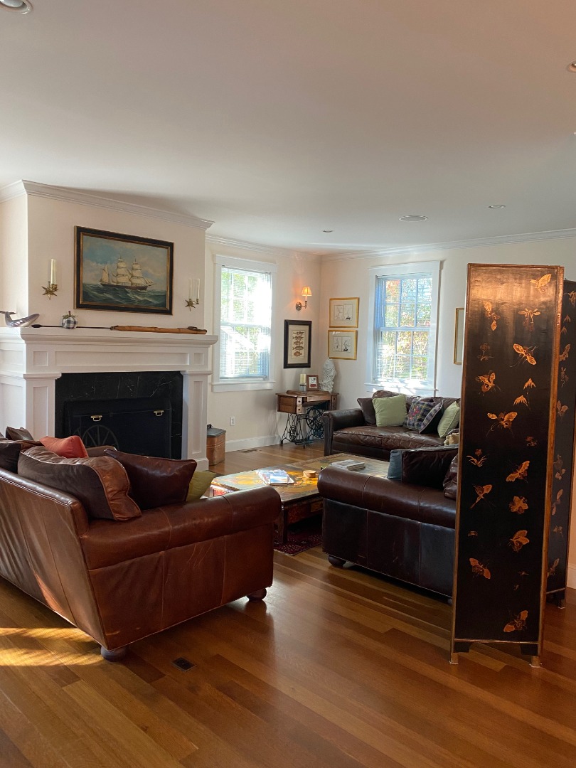 12 Spring Street Vineyard Haven, MA 02568 - Photo 6 of 40 a living room with furniture and a fireplace