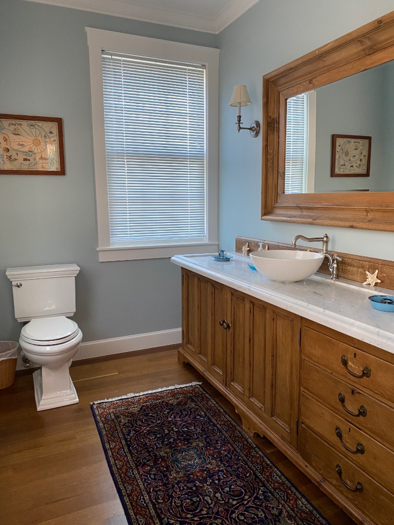 12 Spring Street Vineyard Haven, MA 02568 - Photo 8 of 40 a bathroom with a sink a toilet and mirror