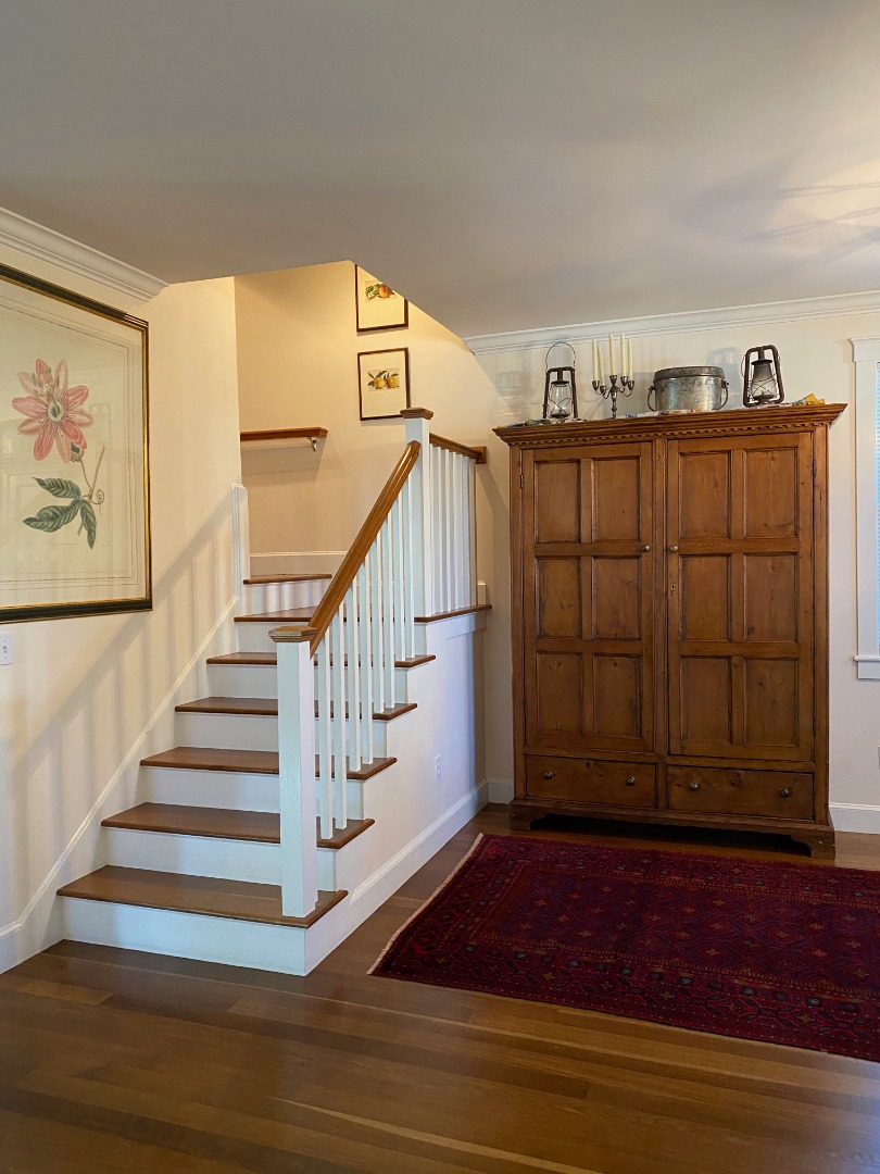 12 Spring Street Vineyard Haven, MA 02568 - Photo 9 of 40 a view of entryway with stairs and wooden floor