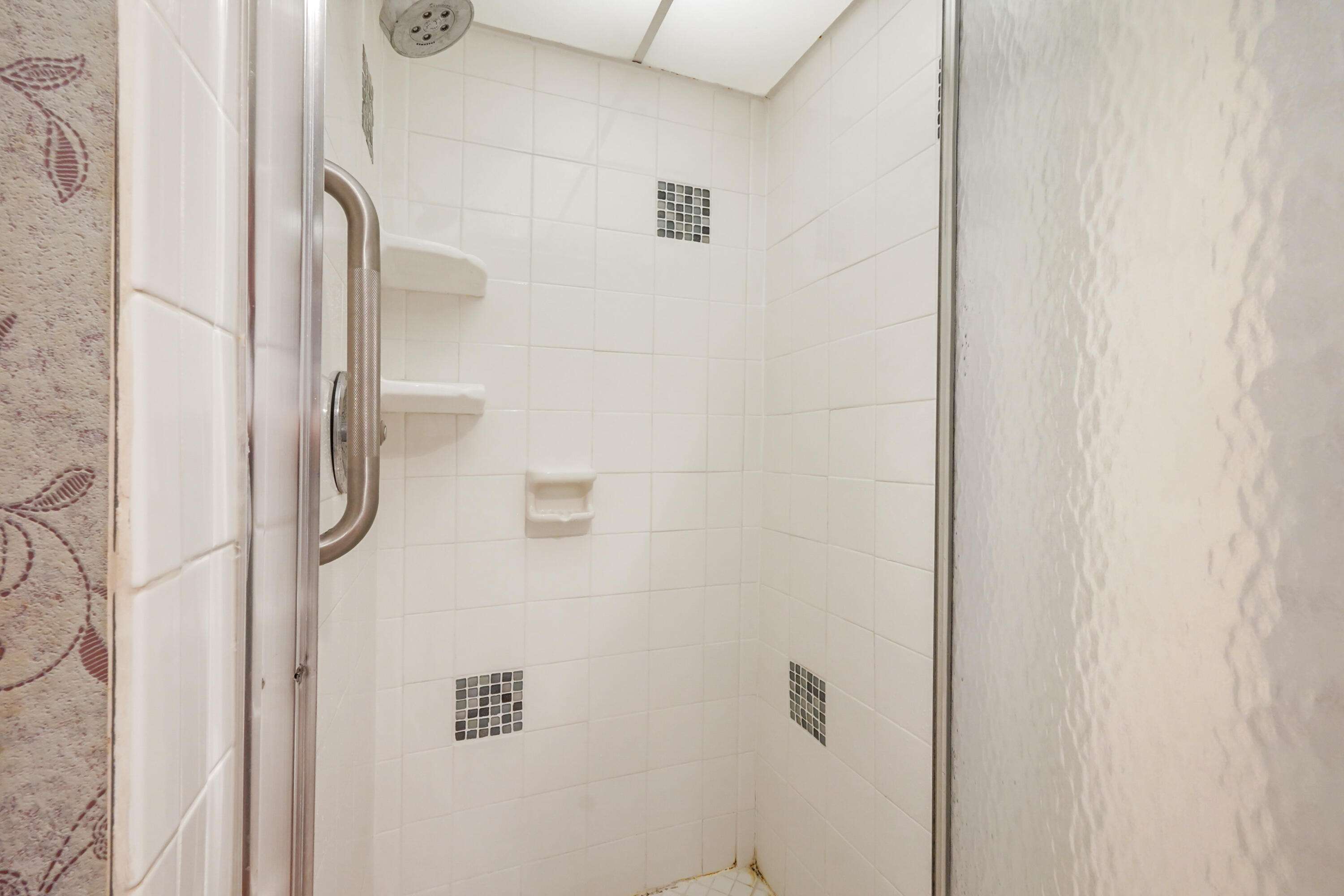 16 Normandy A Delray Beach, FL 33484 - Photo 22 of 46 a bathroom with a shower