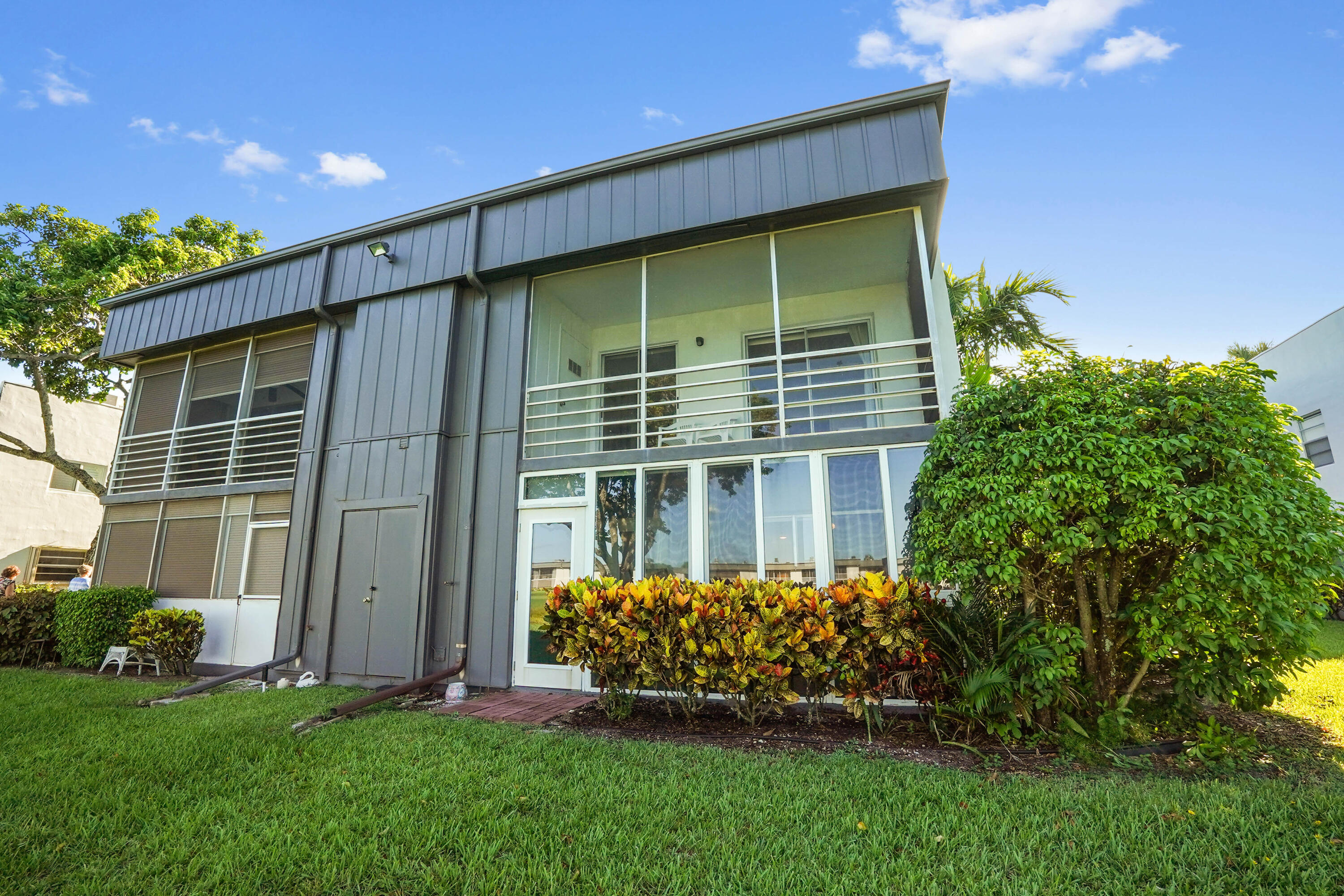 16 Normandy A Delray Beach, FL 33484 - Photo 28 of 46 a house view with a garden space