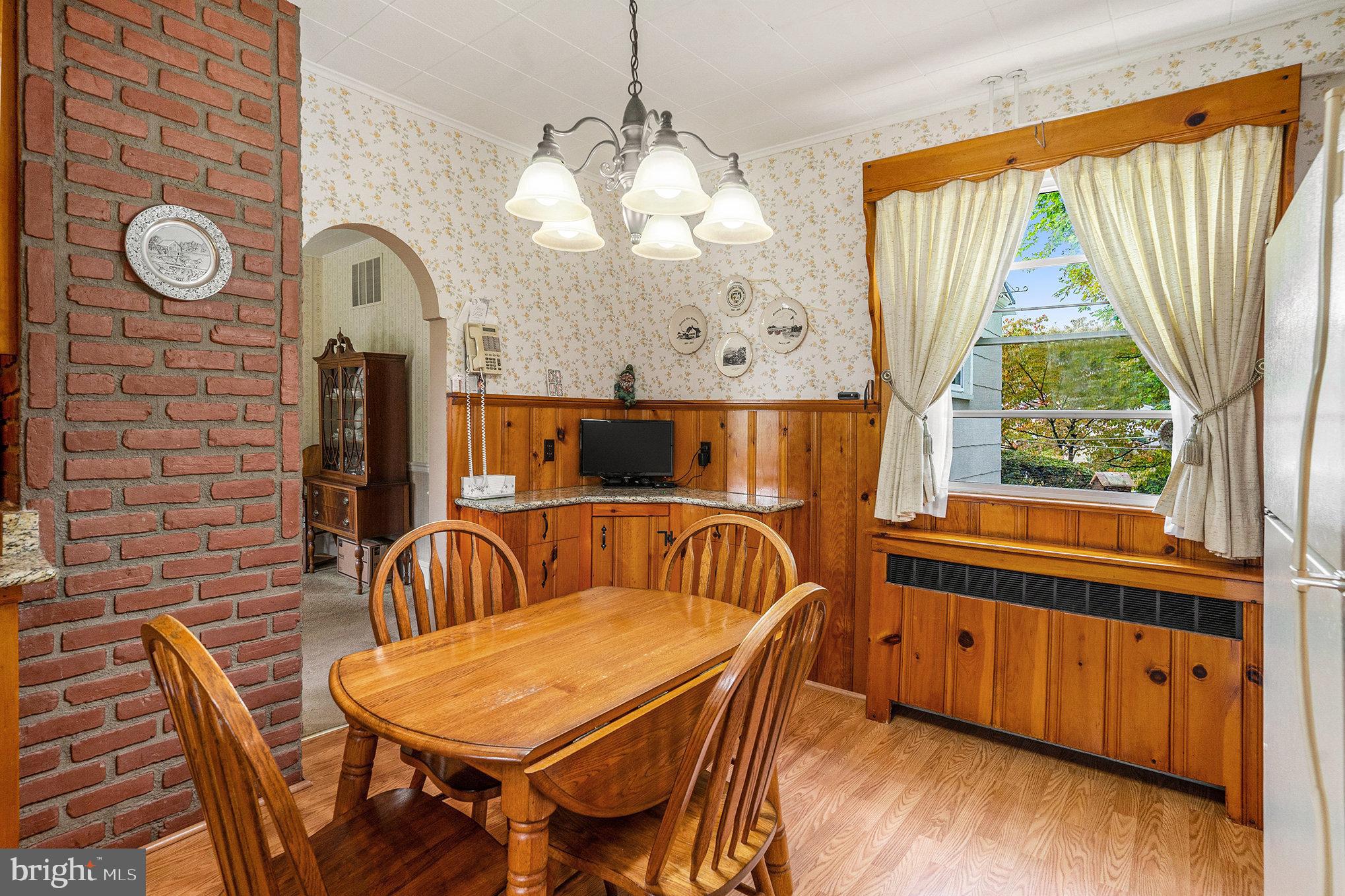 1640 Walnut Avenue Oreland, PA 19075 - Photo 15 of 45 a view of a dining room with furniture window and wooden floor