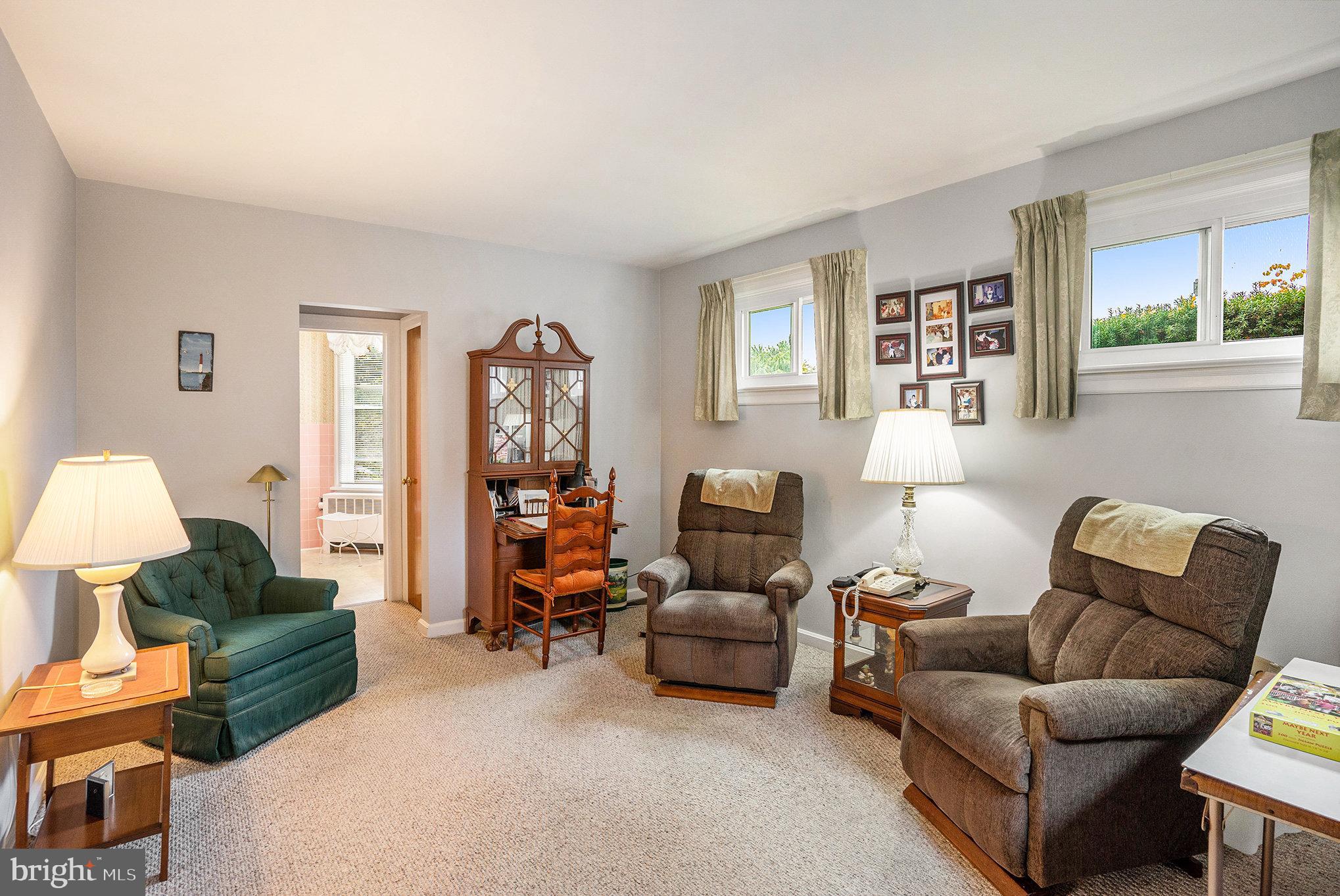 1640 Walnut Avenue Oreland, PA 19075 - Photo 19 of 45 a living room with furniture two night stand and a window