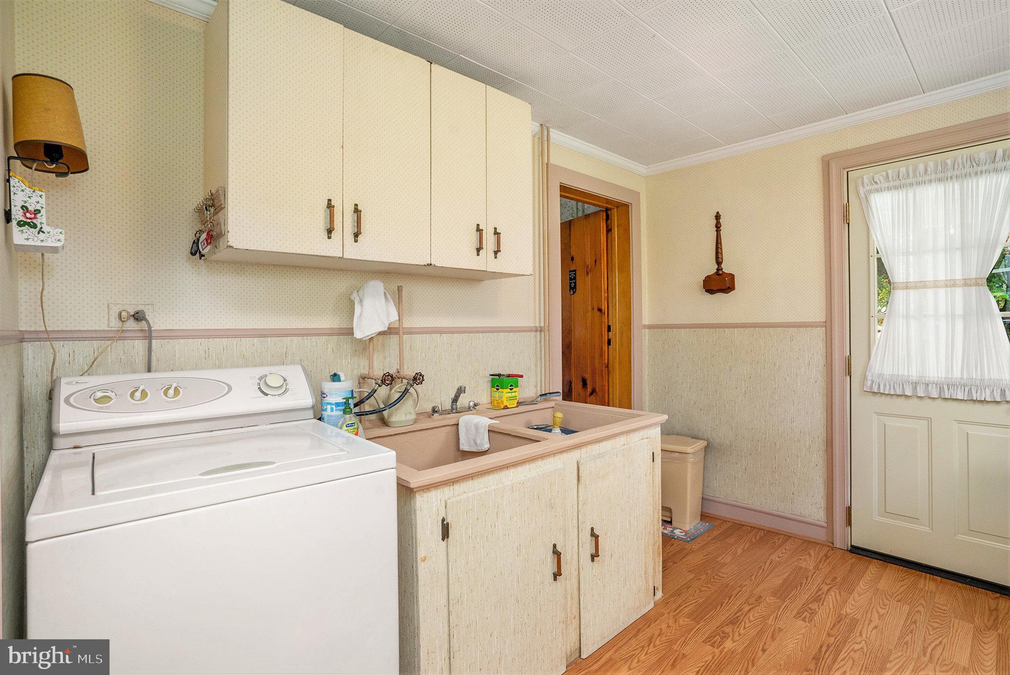 1640 Walnut Avenue Oreland, PA 19075 - Photo 23 of 45 a view of washer and dryer with kitchen in the background