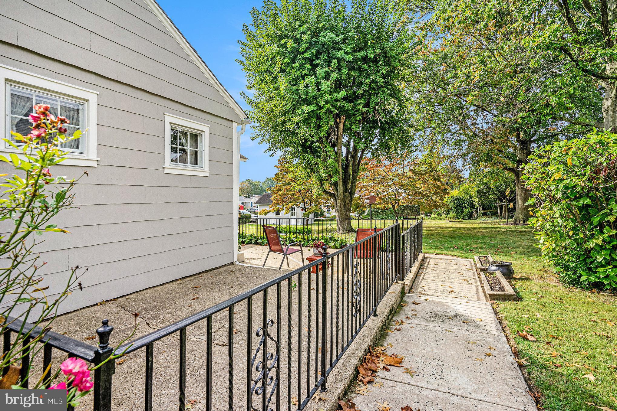 1640 Walnut Avenue Oreland, PA 19075 - Photo 39 of 45 a view of a pathway with a wrought fence