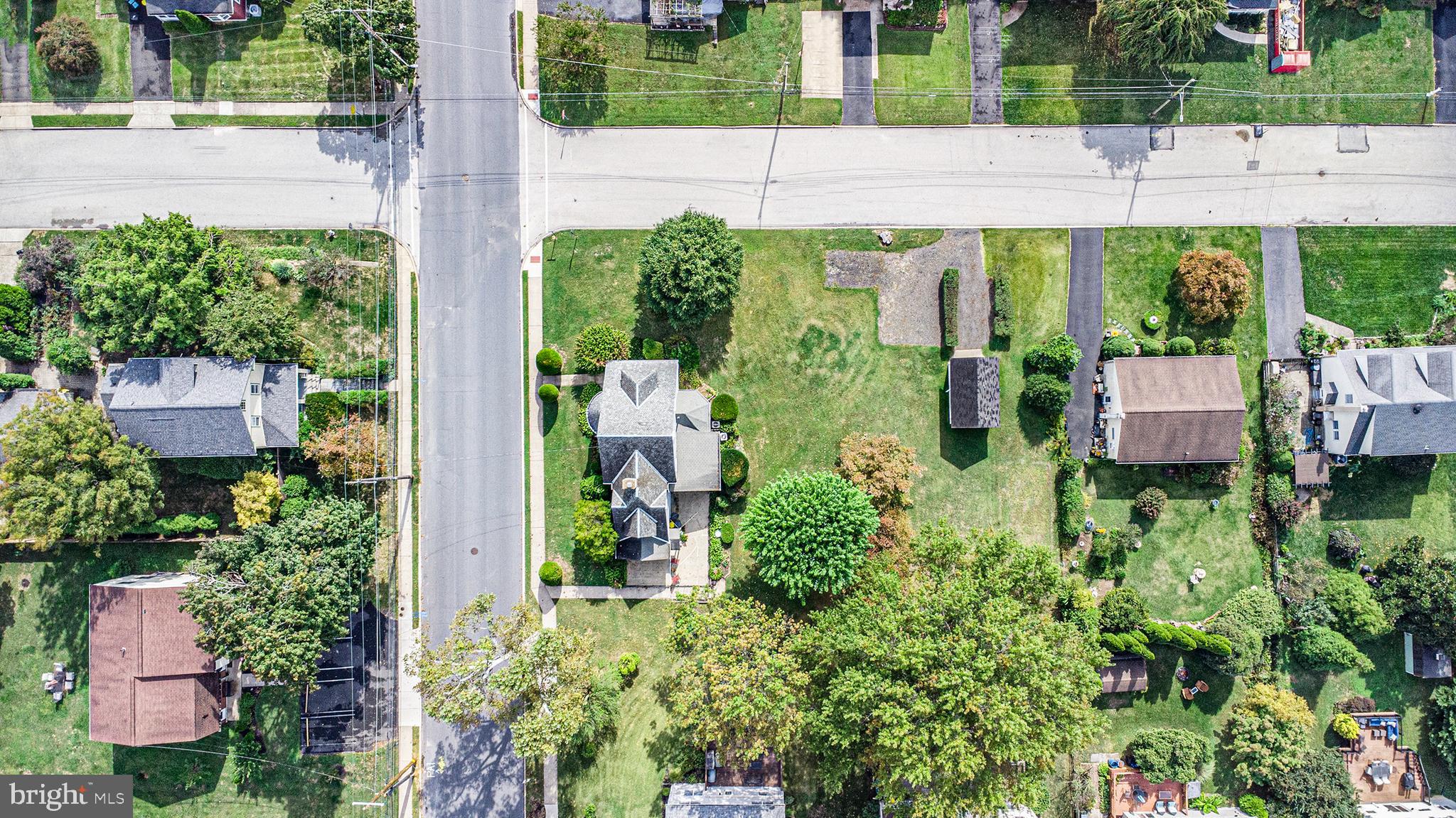 1640 Walnut Avenue Oreland, PA 19075 - Photo 43 of 45 a aerial view of a house with a yard and table and chairs potted plants