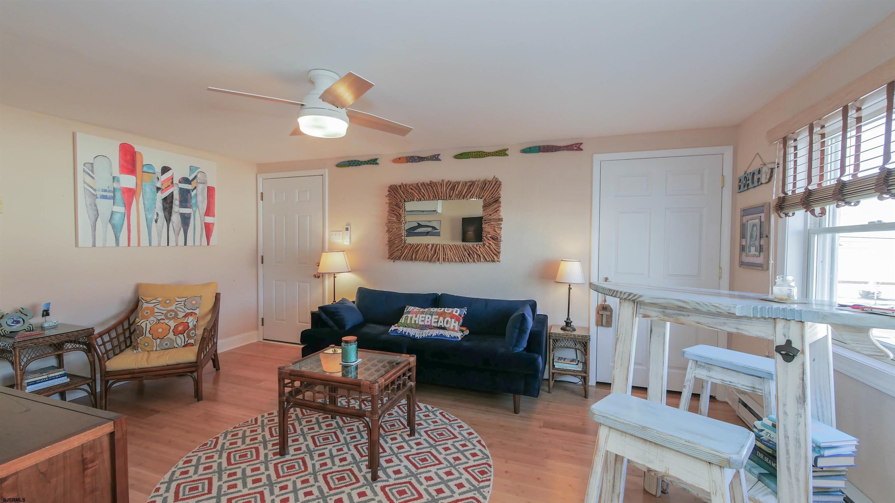 1000 West Brigantine Avenue, Unit 4 Brigantine, NJ 08203 - Photo 5 of 19 a living room with furniture and a window