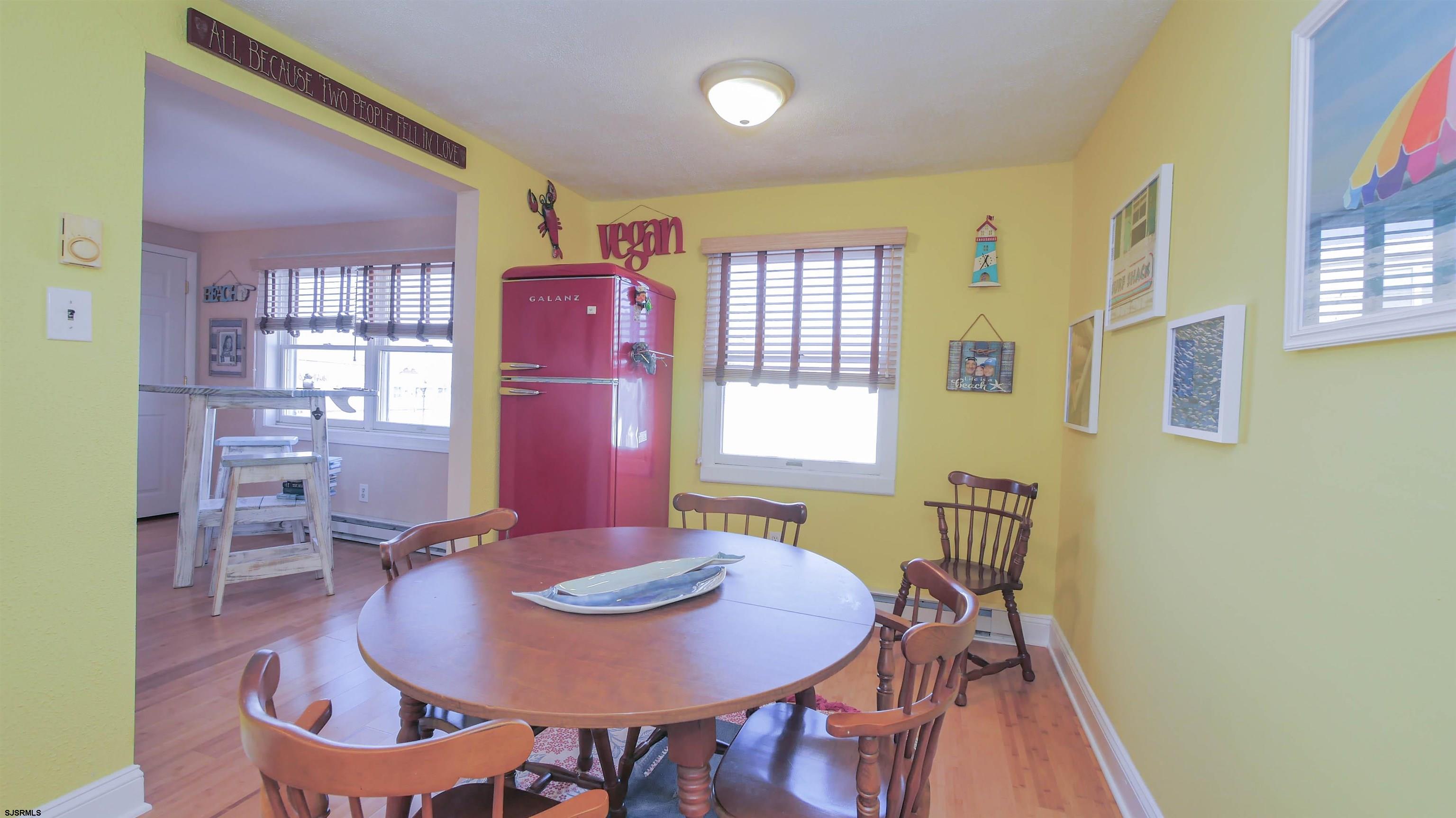 1000 West Brigantine Avenue, Unit 4 Brigantine, NJ 08203 - Photo 8 of 19 a view of a dining room with furniture and window