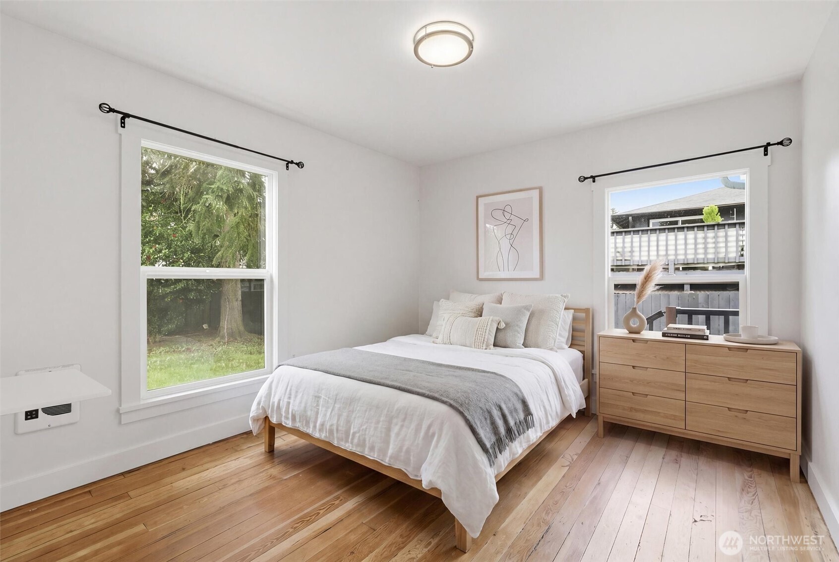 1651 Southwest 114th Street Seattle, WA 98146 - Photo 18 of 37 a bedroom with a bed and a window