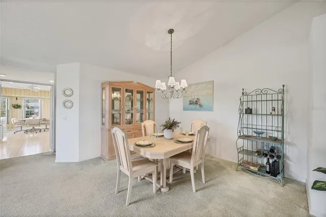 a living room with furniture and a ceiling fan