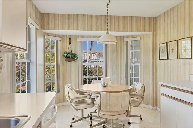 a bedroom with a bed and a chair