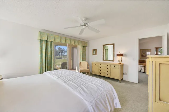 a view of a livingroom with furniture and a flat screen tv