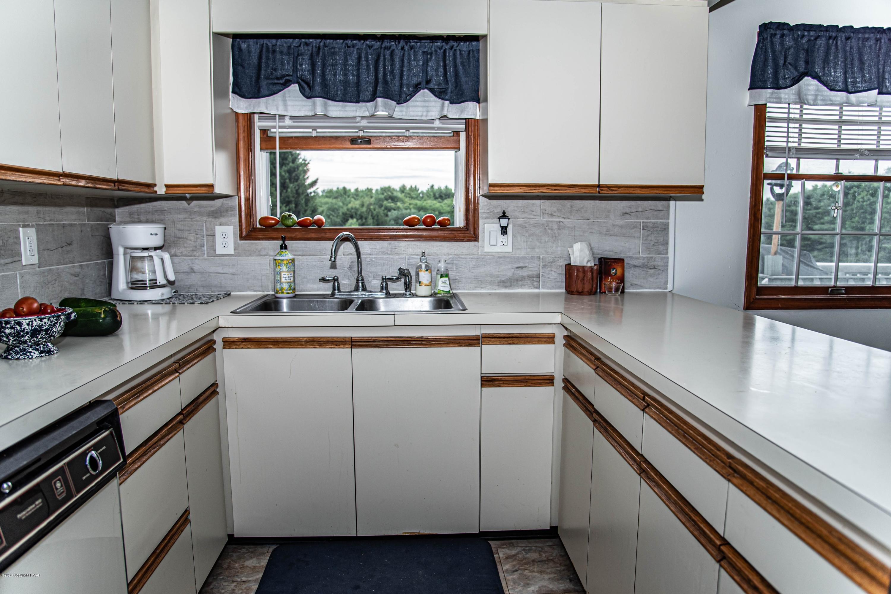 187 Old Stagecoach Road Gilbert, PA 18331 - Photo 13 of 31 a kitchen with a sink and cabinets