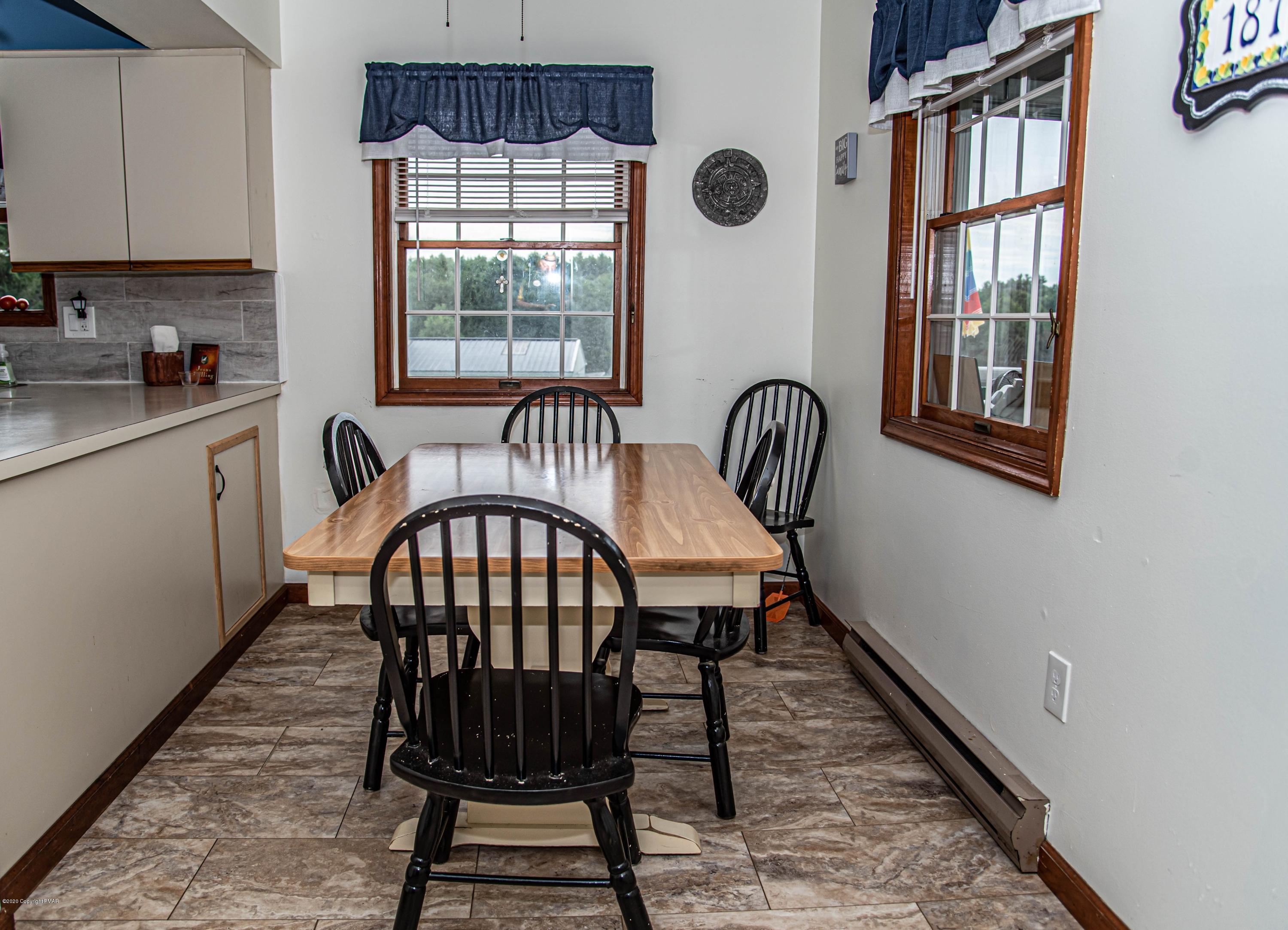 187 Old Stagecoach Road Gilbert, PA 18331 - Photo 14 of 31 a view of a dining room with furniture window and wooden floor