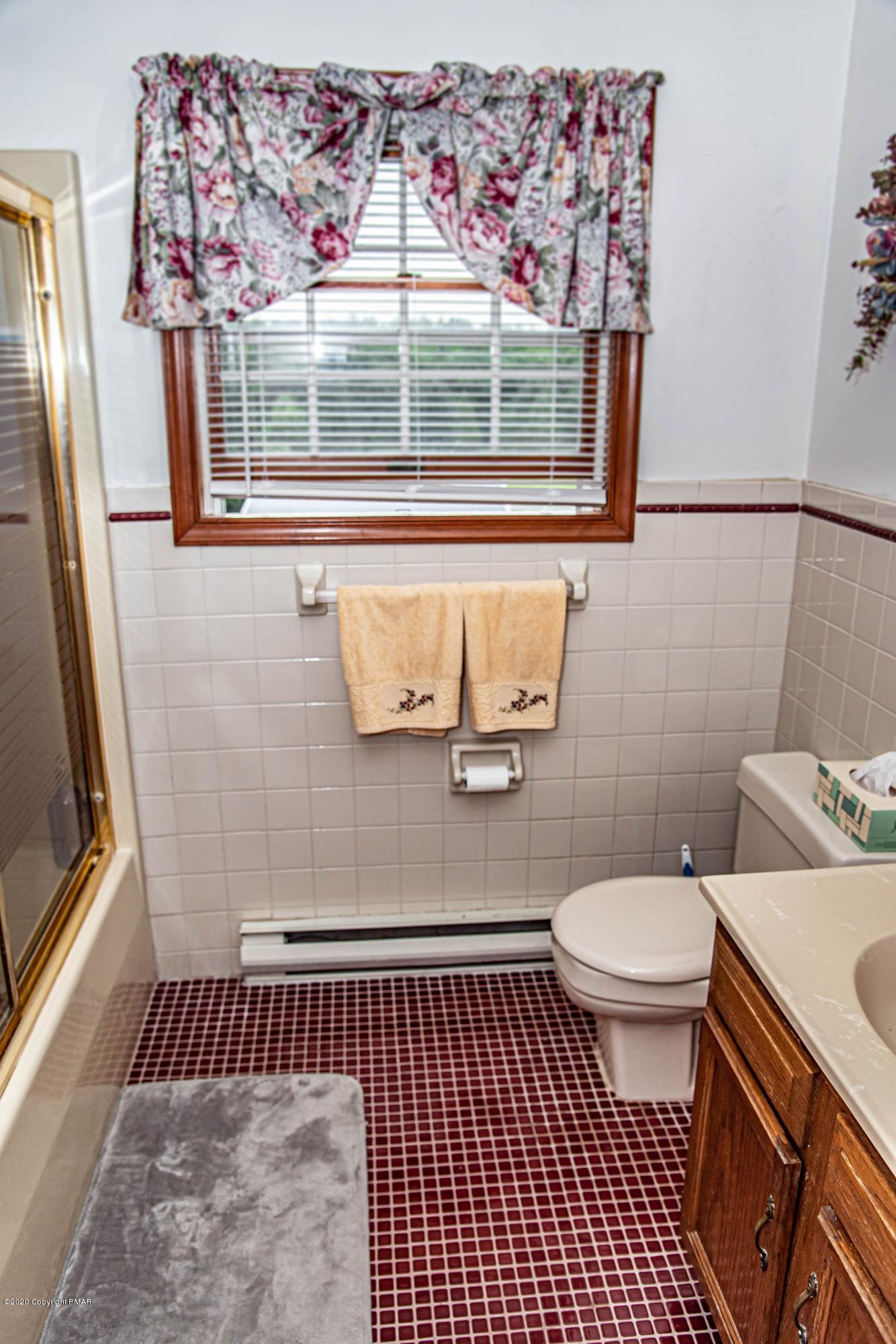 187 Old Stagecoach Road Gilbert, PA 18331 - Photo 18 of 31 a bathroom with a sink and a toilet