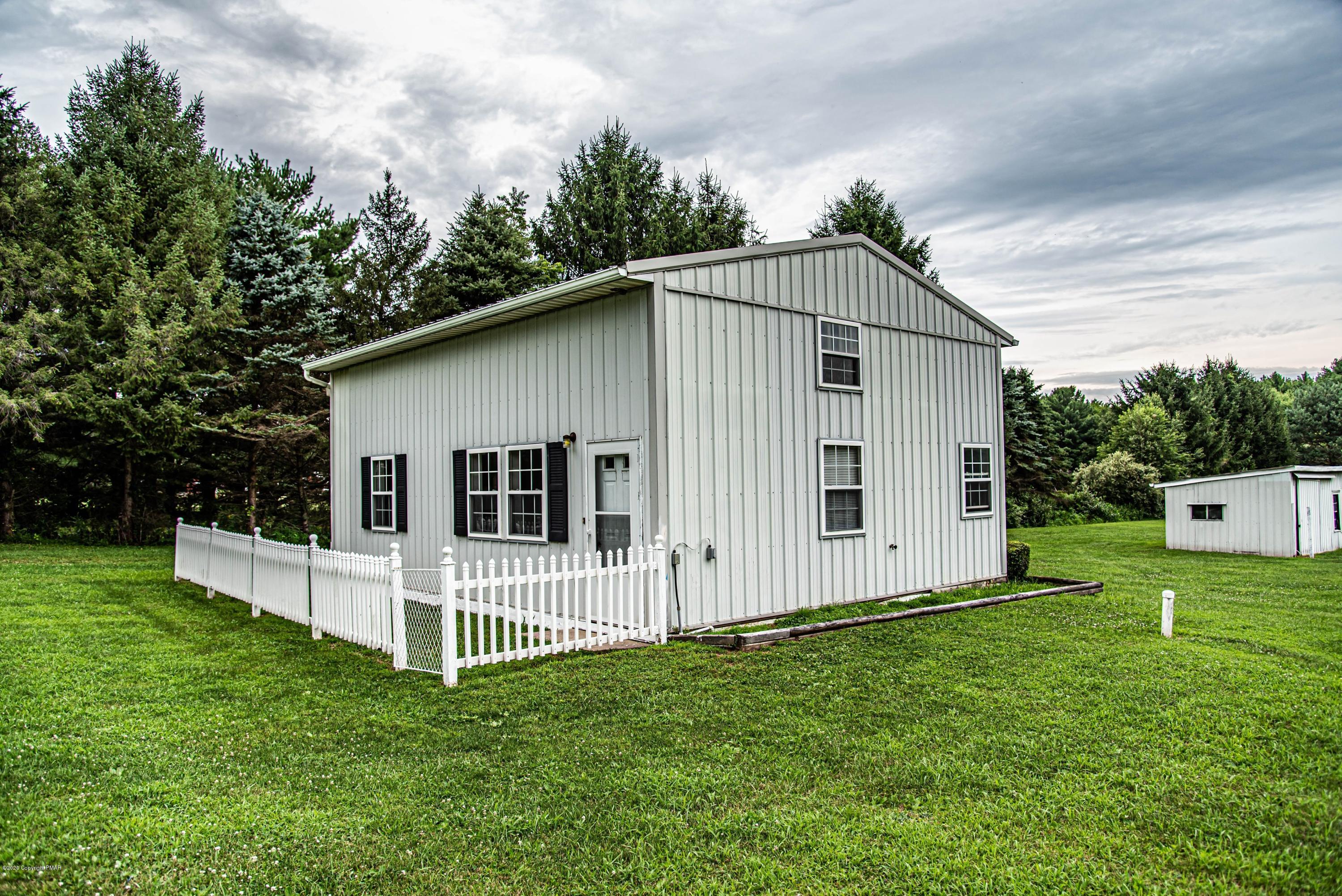 187 Old Stagecoach Road Gilbert, PA 18331 - Photo 24 of 31 a view of a house with backyard