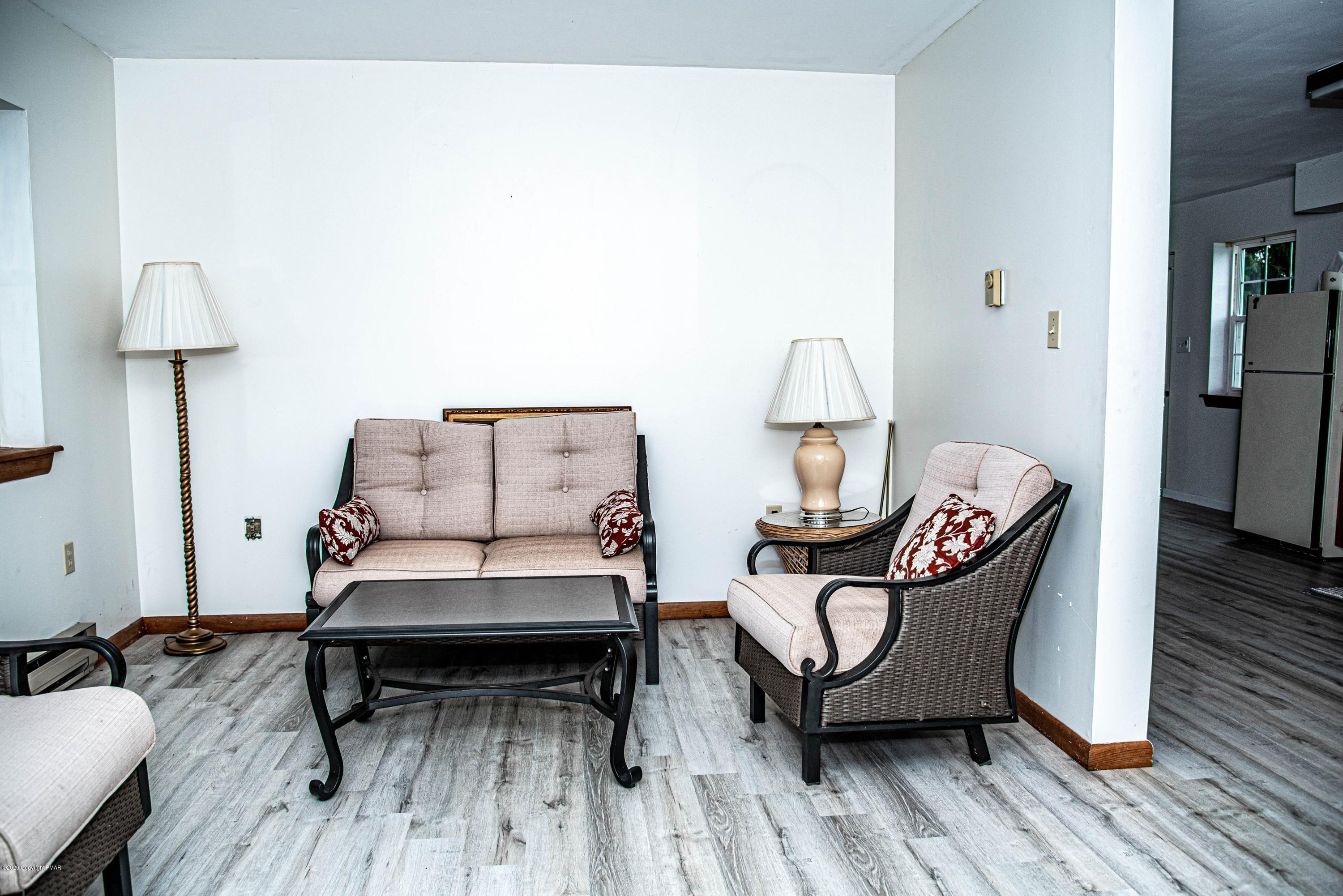 187 Old Stagecoach Road Gilbert, PA 18331 - Photo 27 of 31 a living room with furniture and a wooden floor
