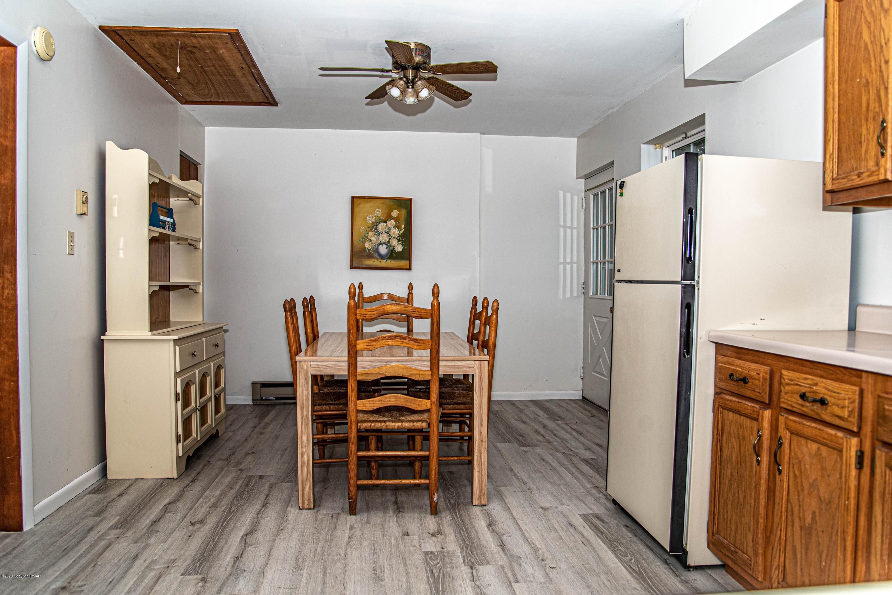187 Old Stagecoach Road Gilbert, PA 18331 - Photo 28 of 31 a dining room with furniture and wooden floor