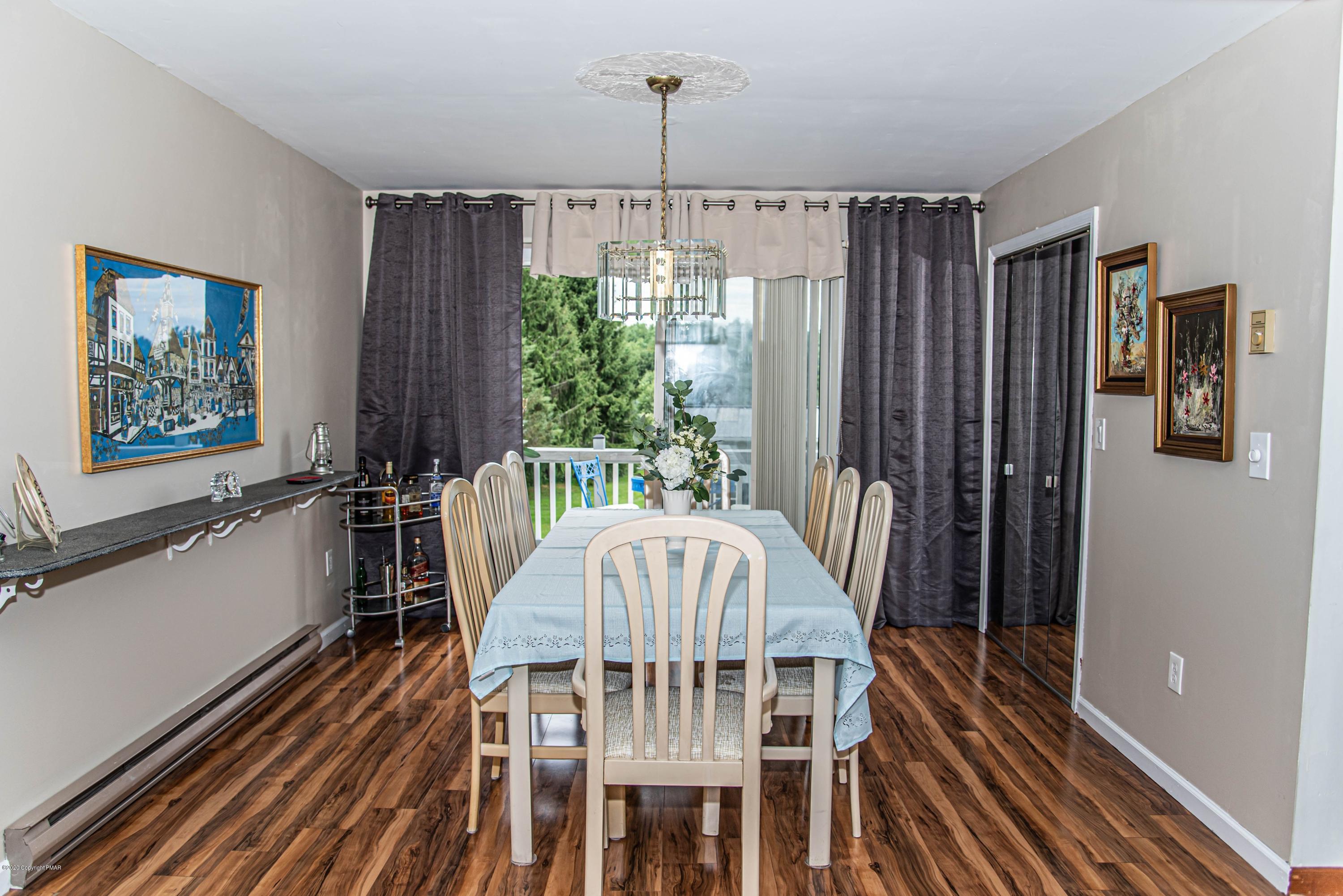 187 Old Stagecoach Road Gilbert, PA 18331 - Photo 10 of 31 a view of a dining room with furniture window and wooden floor