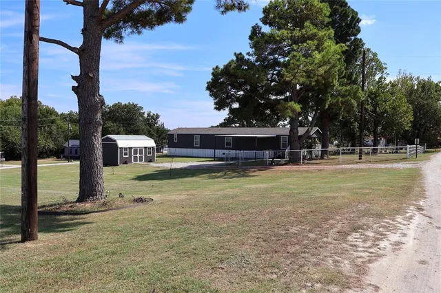 a swimming pool view with a garden