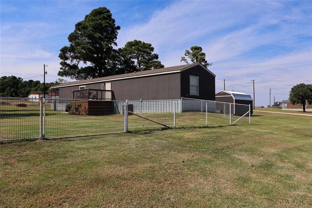 130 Firefly Drive Springtown, TX 76082 - Photo 24 of 25 a view of backyard with trampoline