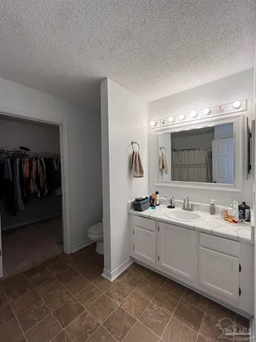 a bathroom with a double vanity sink and mirror