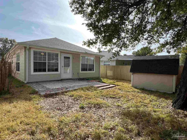a view of a house with a yard and garage