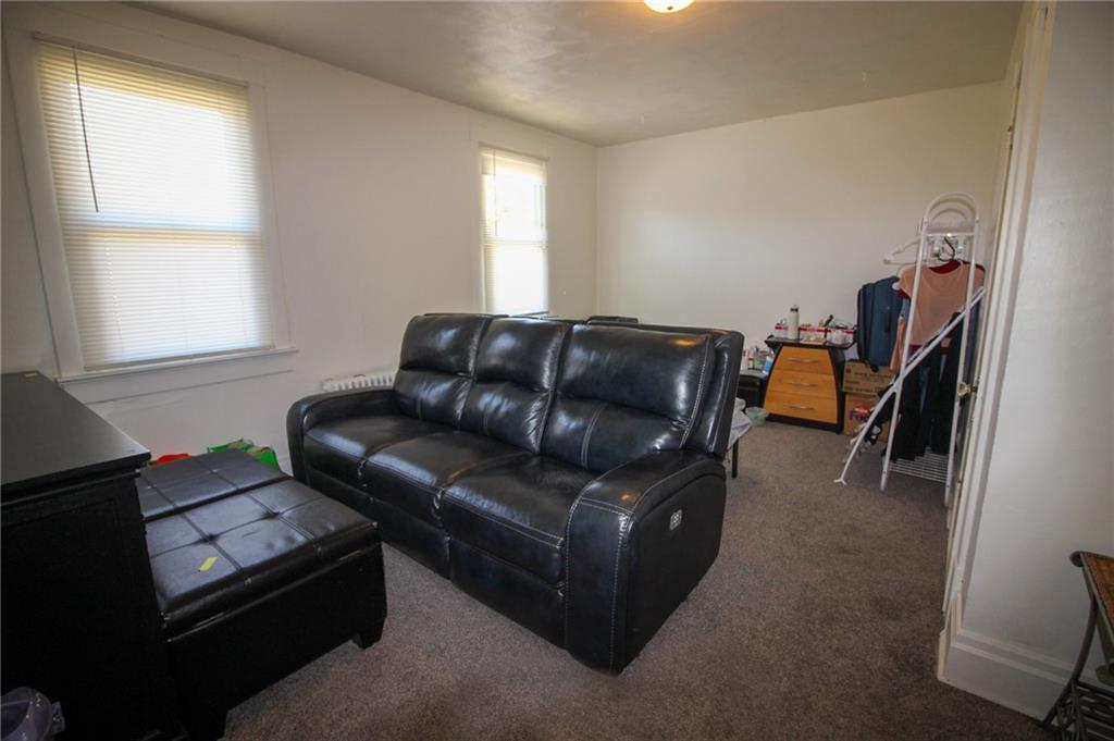 244 Center Street Springdale, PA 15144 - Photo 11 of 32 a living room with furniture and a window
