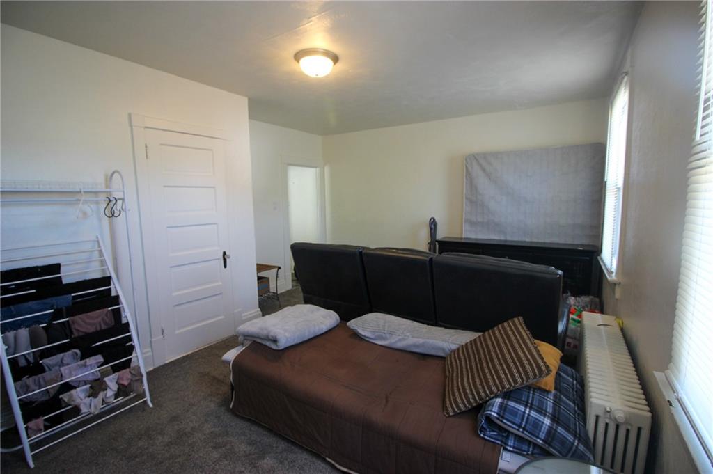 244 Center Street Springdale, PA 15144 - Photo 12 of 32 a living room with furniture and a closet