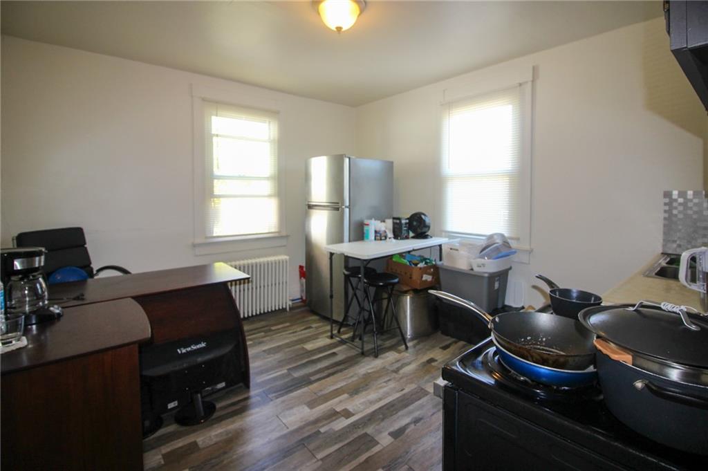 244 Center Street Springdale, PA 15144 - Photo 15 of 32 a view of a workspace with furniture and a window