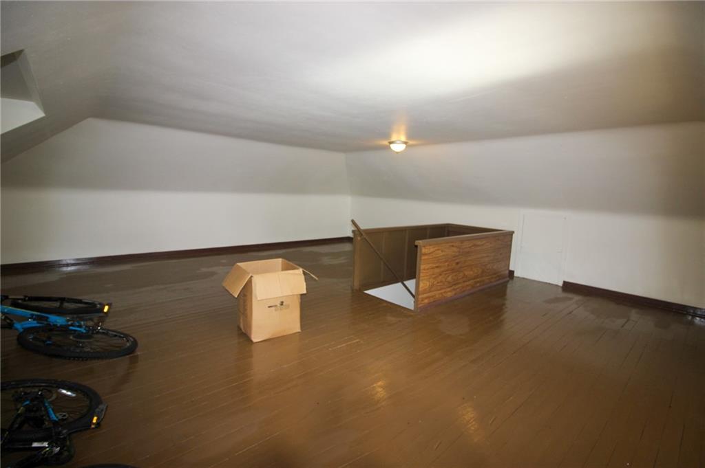 244 Center Street Springdale, PA 15144 - Photo 20 of 32 a kitchen with a sink and a stove with wooden floor